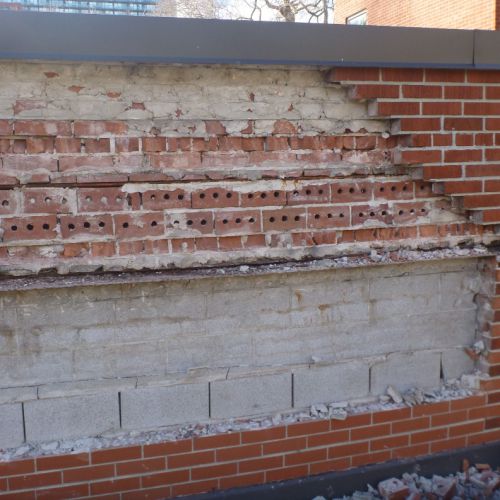 Masonry restoration of brick veneer wall
