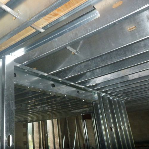 Cold-formed steel joists for new mezzanine floor and studs for interior office partitions