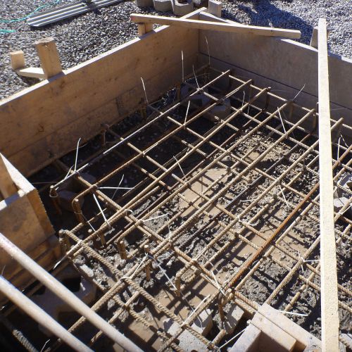 Reinforced concrete footings and foundations